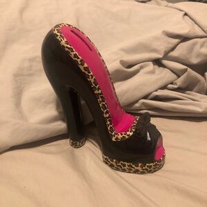 Black and leopard print stiletto heel piggy bank. It’s never been used.